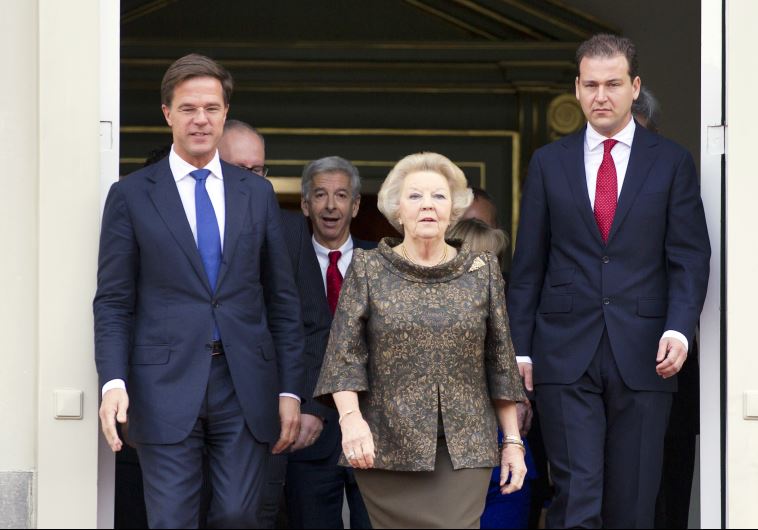 Queen Beatrix of the Netherlands (C), Prime Minister Mark Rutte (L) and Deputy Prime Minister Lodewijk Asscher.