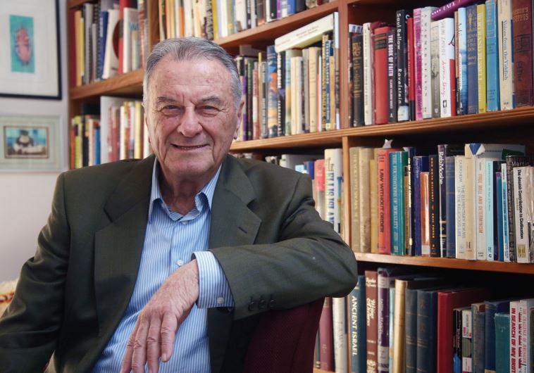 Larry Frisch in his book-lined apartment, in a retirement home adjacent to the Islamic Museum