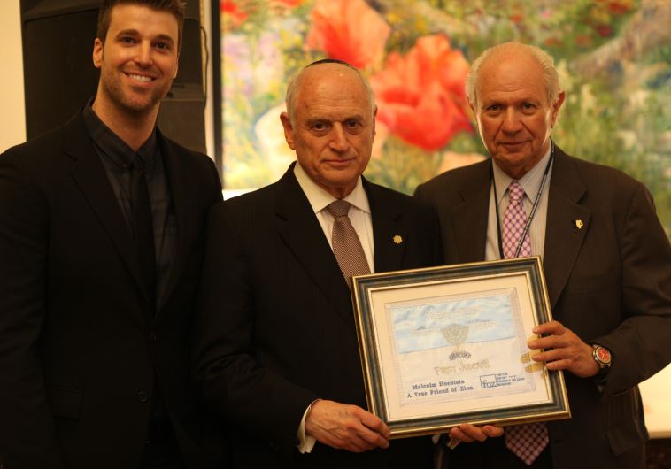 Michael Evan Jr. presenting John Patterson Award to Executive Vice Chair of the Conference of Presidents of Major American Jewish Organizations Malcolm Hoenlein.