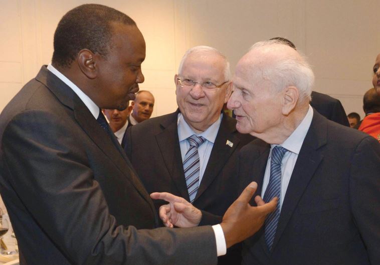 PRESIDENT UHURU KENYATTA chats with Supreme Court president emeritus Meir Shamgar on Tuesday, while President Reuven Rivlin looks on.