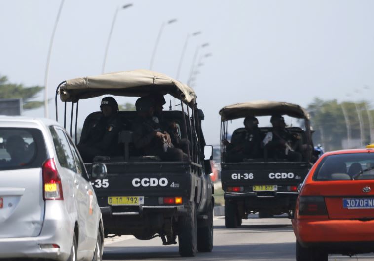 Security forces drive towards Grand Bassam in Abidjan, Ivory Coast, March 13, 2016