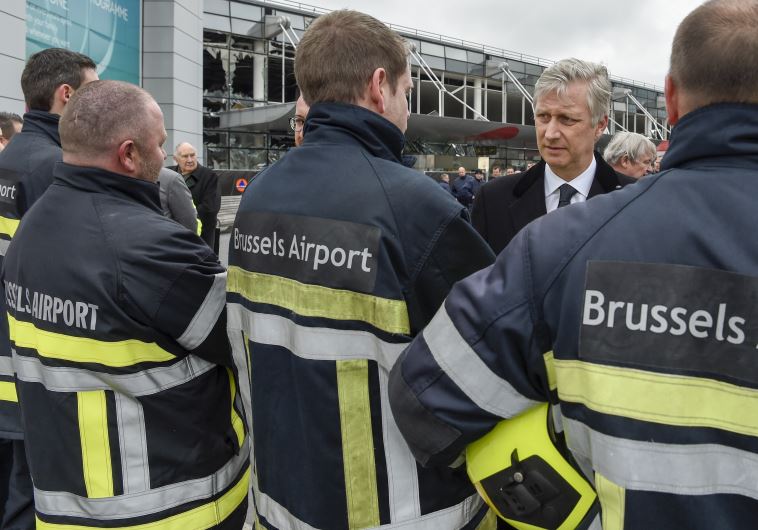Belgian King Philippe attends a ceremony outside the terminal at Brussels national airport following bomb attacks in the city, March 23, 2016