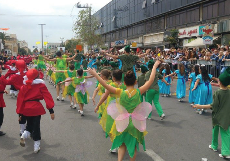 CROWDS CHEER from the sidelines as angels, elves, dwarves and other storybook characters take over main Herzliya thoroughfares in yesterday’s annual Adloyada event. 