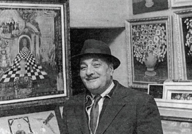 A falafel maven surrounded by his works of art