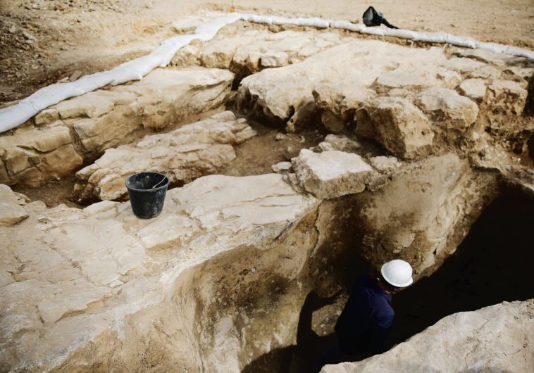An Antiquities Authority employee works inside a ritual bath, part of a find exposed in Jerusalem this past March