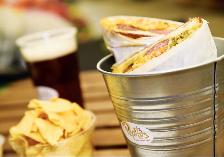 The choripan sandwich – Argentinean chorizo on bread with vegetables and homemade sauces