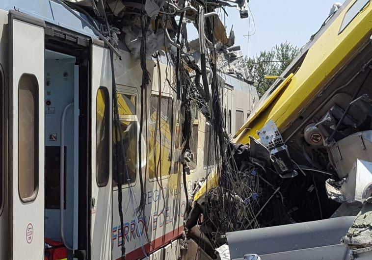 Two passenger trains are seen after a collision in the middle of an olive grove in the southern village of Corato, near Bari, Italy, in this handout picture released by Italian Firefighters July 12, 2016