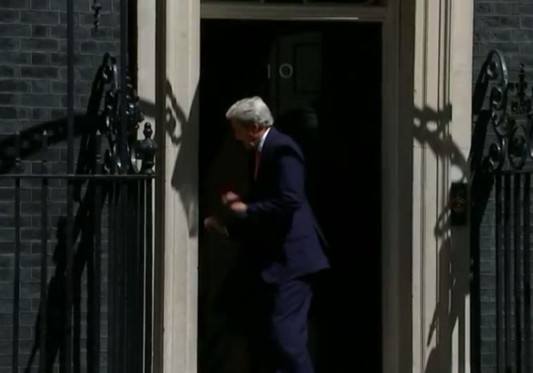 John Kerry accidentally bumps into Downing Street door