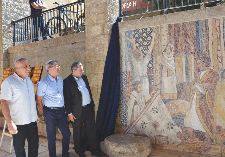 (From left) Itai Betsalel of the Company for the Reconstruction and Development of the Jewish Quarter, Deputy Mayor Meir Turgeman and Jerusalem Affairs Minister Ze’ev Elkin at the mosaic launch ceremony in the Cardo