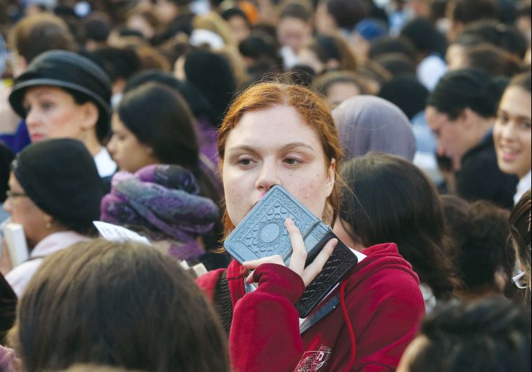 Women pray at the Western Wall in Jerusalem