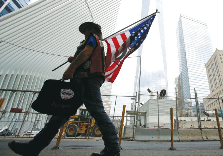 A man arrives at the World Trade Center complex on the morning of the 15th anniversary of the 9/11 attacks in Manhattan this week