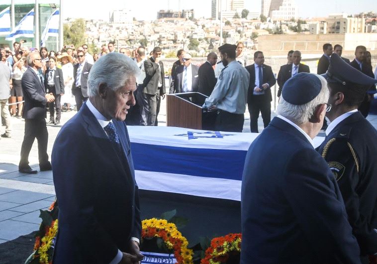 Bill Clinton pays respects to late former Israeli president Shimon Peres outside the Knesset in Jerusalem, September 29, 2016