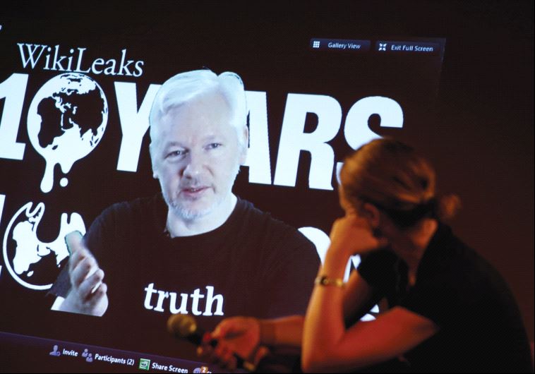 JULIAN ASSANGE, WikiLeaks founder and editor-in-chief, via video link, and Sarah Harrison, a WikiLeaks journalist, attend a press conference celebrating the organization’s 10th anniversary in Berlin on Tuesday.