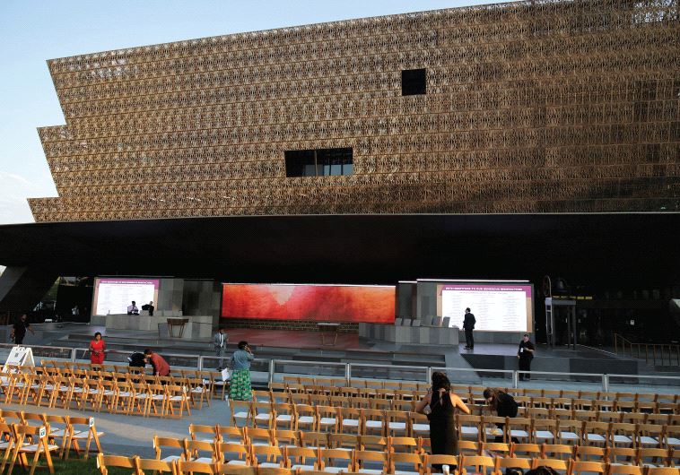 PEOPLE GATHER ahead of the dedication of the Smithsonian’s National Museum of African American History in Washington, D.C. 