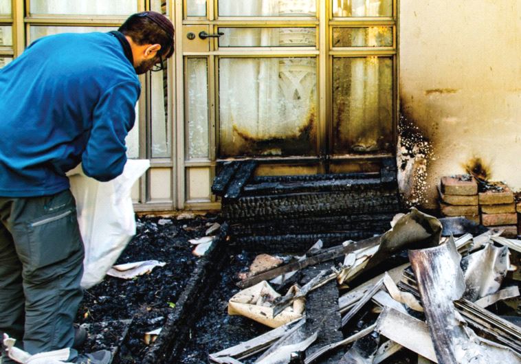 Debris clogs the waterlogged entrance to Haifa’s Moriah Congregation (masorti)