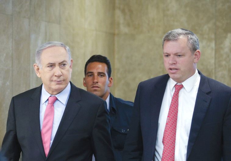 PRIME MINISTER Benjamin Netanyahu is accompanied by PMO Director-General Eli Groner to the weekly government meeting in Jerusalem