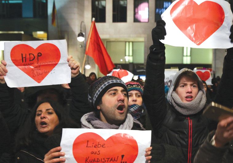 GERMANS WITH signs of love after the Christmas market terrorist attack in Berlin.