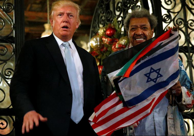 Donald Trump (L) and boxing promoter Don King speak to reporters outside the Mar-a-lago Club in Palm Beach, Florida, US on December 28, 2016