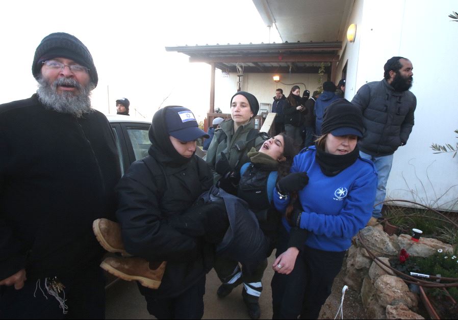Residents of Amona are forcibly removed by Israeli security forces.