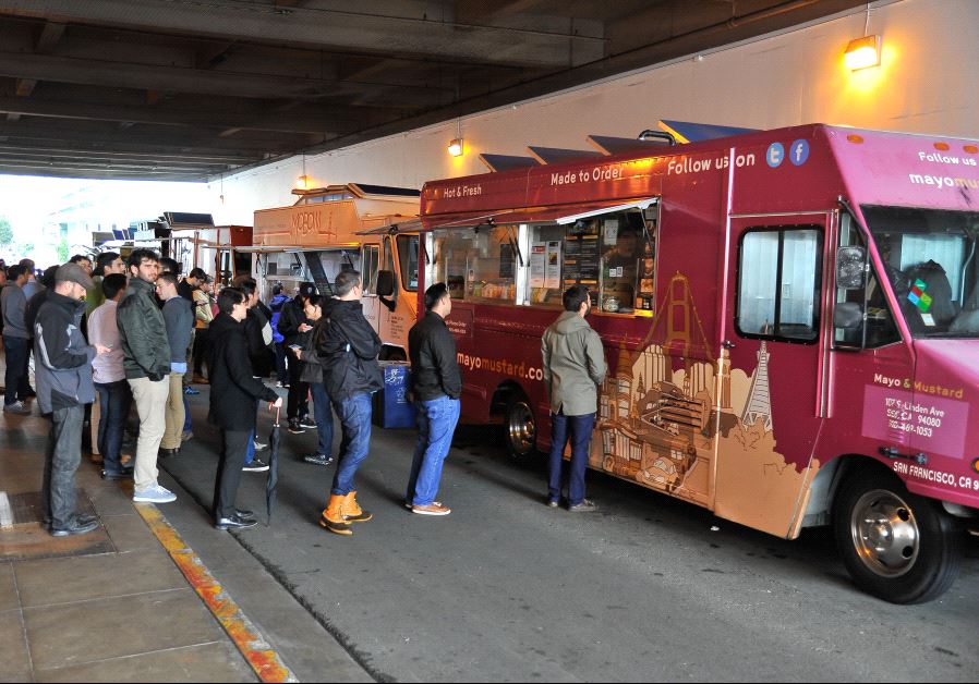 People line up at a food truck in San Francisco , California