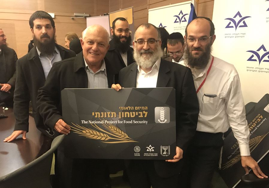 Labor and Social Services Minister Haim Katz along with Mendy Blau, Israel director of Colel Chabad at the launch of the food security initiative in the Knesset