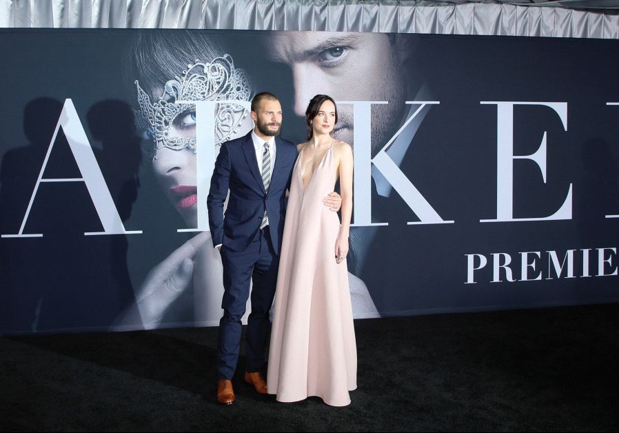 Cast members Jamie Dornan and Dakota Johnson pose at the premiere of the film ‘Fifty Shades Darker’ in Los Angeles last week