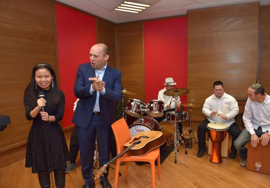 Education Minister Naftali Bennett joins Shalva band on guitar