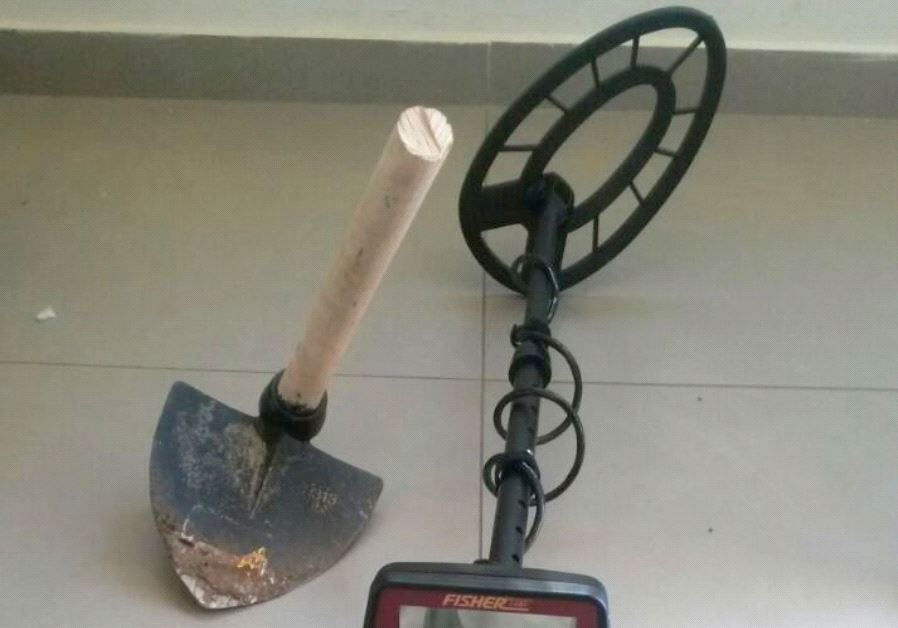 Seized metal detector and pickax used in suspected antiquities theft