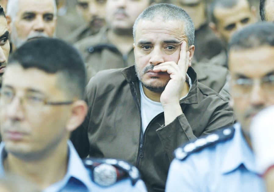AHMAD DAQAMSEH, the Jordanian Army corporal who massacred seven Beit Shemesh schoolgirls in March 1997, is seen at Umm Alloul Prison in Mafraq, 80 km. north of Amman, in July 2013.