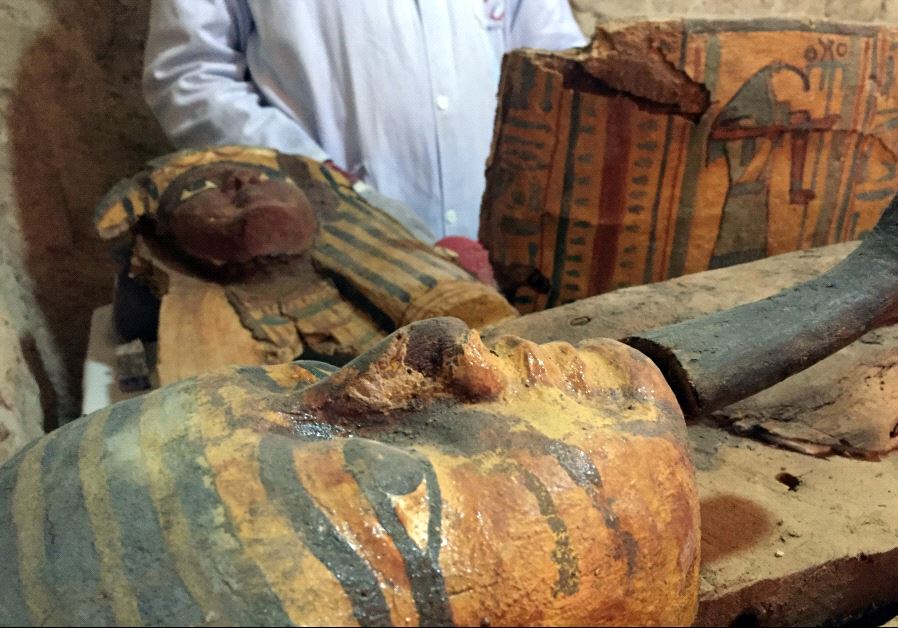 An Egyptian archaeologist documents the content of the tomb of Userhat, a judge from the New Kingdom at the Dra Abu-el Naga necropolis near the Nile city of Luxor, south of Cairo.