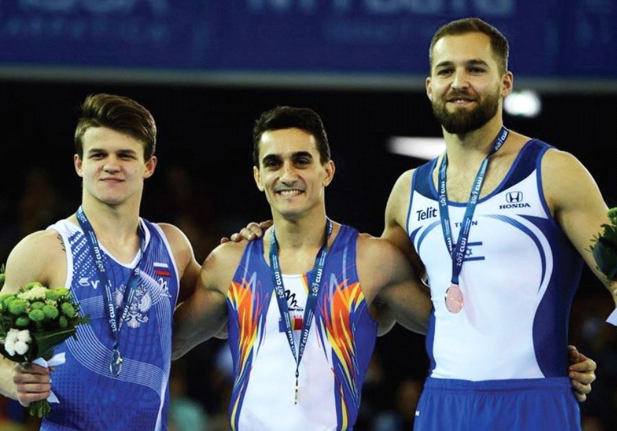 Israel’s Alex Shatilov (right) won the bronze medal in the floor final at the European Artistic Gymnastics Championships Romania yesterday, finishing behind Romanian winner Marian Dragulescu (center) and Russia’s Dmitri Lankin (left).
