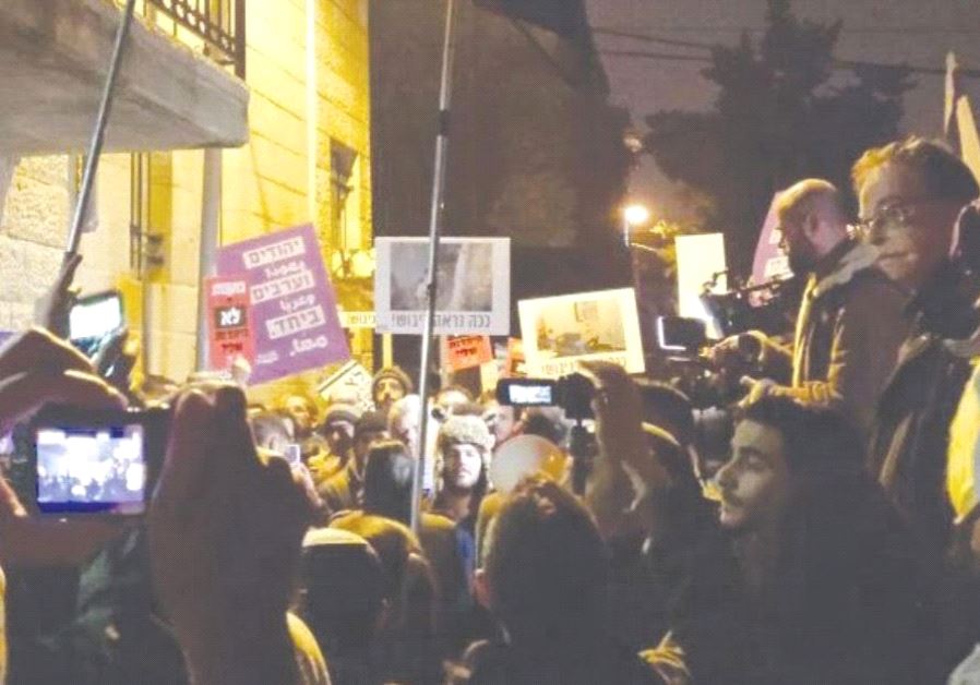 Protesters and supporters of Breaking the Silence lecture gather outside of Barbur Art Gallery in Jerusalem in February