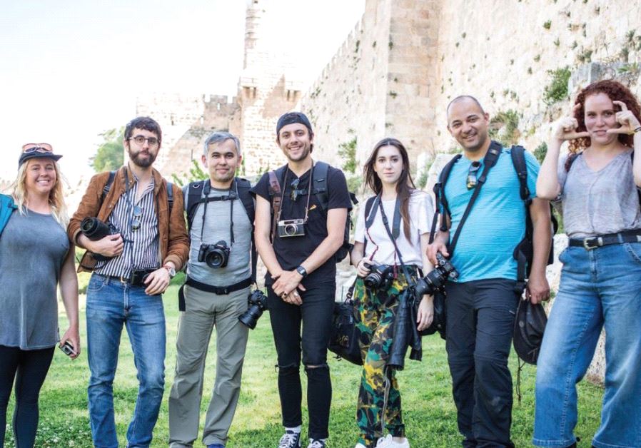 THE GROUP of photographers and their guides pose for a photo outside the Old City of Jerusalem yesterday.