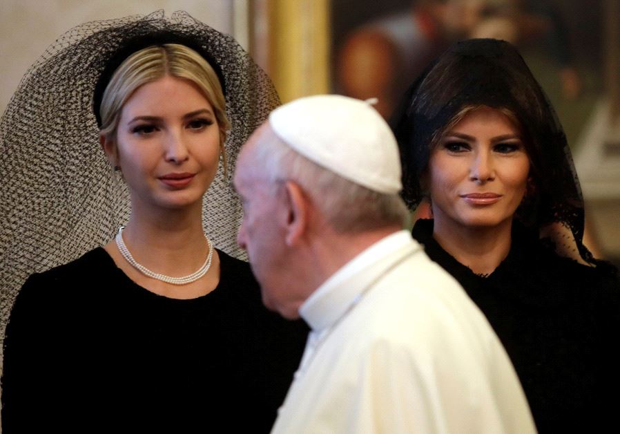 Pope Francis walks past Ivanka Trump (L) and First Lady Melania Trump during a private audience at the Vatican, May 24, 2017