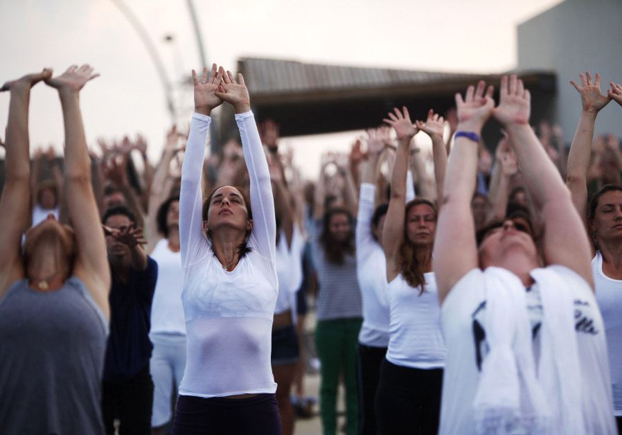 People practice yoga in Tel Aviv [File]
