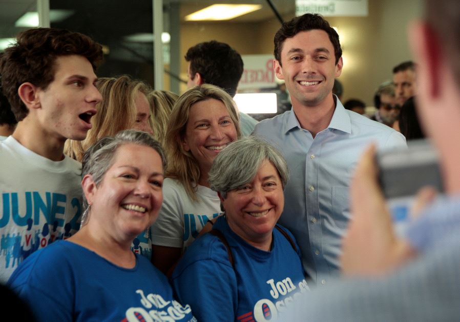 Democratic candidate Jon Ossoff has his picture taken with supporters while campaigning for Georgia's 6th Congressional District special election in Chamblee, Georgia, U.S., June 19, 2017