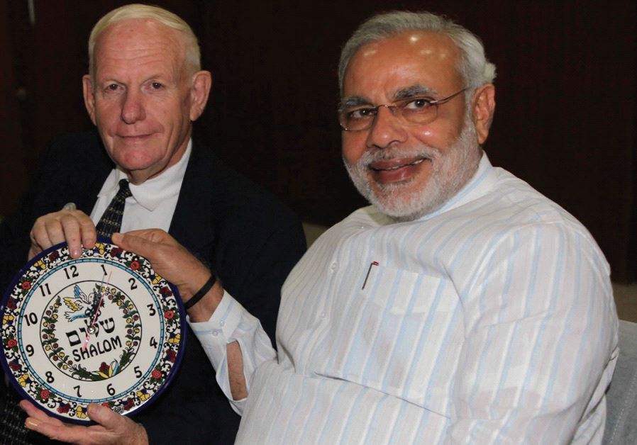 AMNON OFEN, director of NaanDanJain Irrigation, presents a clock to Narendra Modi in 2013 when he was chief minister of Gujarat.